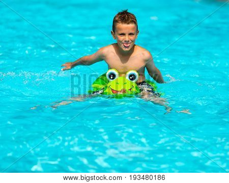 Smiling Boy In Swimming Pool
