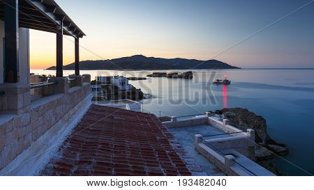 Boat houses in fishing village of Goupa on Kimolos island in Greece.
