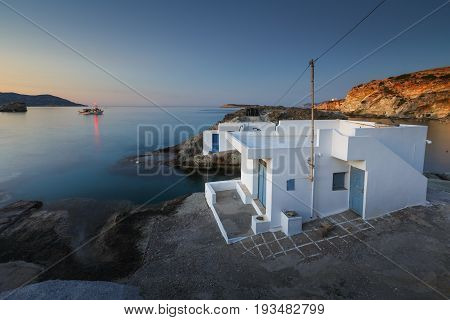 Boat houses in fishing village of Goupa on Kimolos island in Greece.