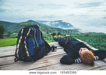 Asian women travel sleep relax. Morning atmosphere nature Forests mountains. Phu Thap Buek Thailand