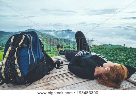 Asian women travel sleep relax. Morning atmosphere nature Forests mountains. Phu Thap Buek Thailand