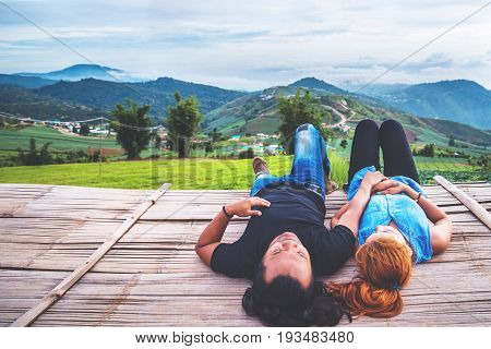 Lover Men and women Asia travel relax. Morning atmosphere nature Forests mountains. Phu Thap Buek Thailand