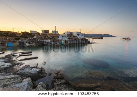 Boat houses in fishing village of Goupa on Kimolos island in Greece.