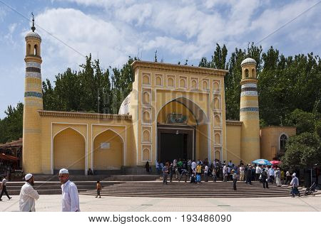 Kashgar China - August 14 2012: People in front of the Id Kah Mosque in the city of Kashgar in China