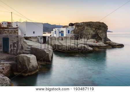 Boat houses in fishing village of Goupa on Kimolos island in Greece.