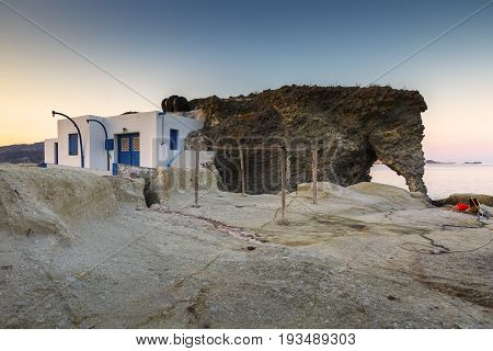 Boat houses in fishing village of Goupa on Kimolos island in Greece.
