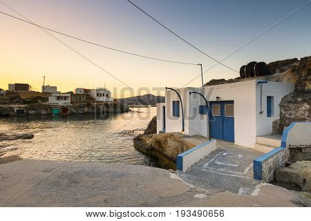 Boat houses in fishing village of Goupa on Kimolos island in Greece.
