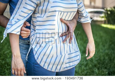 guy making the heimlich maneuver to a girl while she's chocking