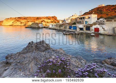 Boat houses in fishing village of Goupa on Kimolos island in Greece.