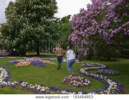Ekaterininsky garden in St. Petersburg. Unknown young girls are posing for a photo.
Photo taken in St. Petersburg on June 12, 2017