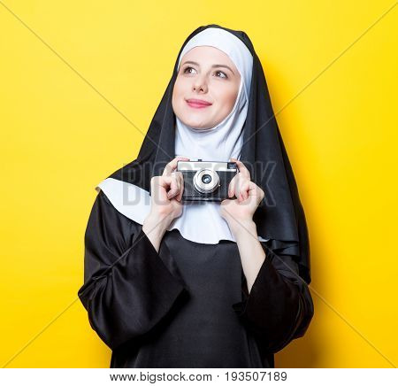Young Happy Nun With Vintage Photo Camera