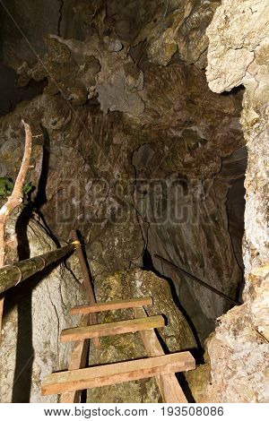 pathway underground cave in Laos, with stalagmites and stalactites.