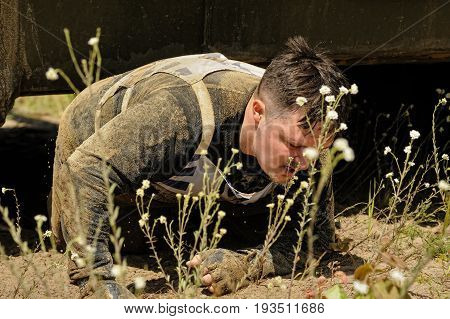 Man Moves Under Tank In Extrim Race. Tyumen