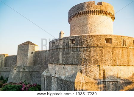 Minceta Tower at sanset lights and Dubrovnik medieval old town city walls, Croatia