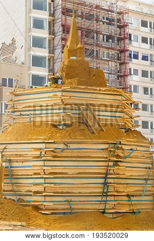 OSTENDE BELGIUM - JUNE 9 2017: Preparation for Sand Sculpture Festival. Sculptures from sand in the course of creation