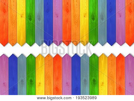 multicolored wooden boards in colors of rainbow. Multicolored wooden fence from colors of rainbow with white space in the middle. Empty place for text
