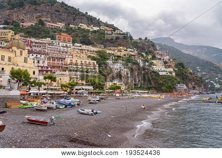 Positano Italy - Septamber 1 2016: View of the beach in famous and picturesque italian town on a clody day right after the rain.