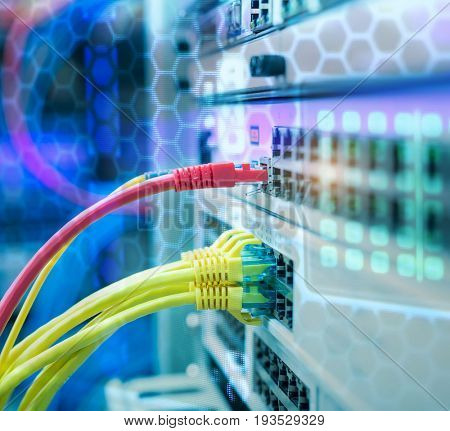 Network cables in switch and firewall in cloud computing data center server rack