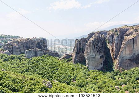 Green trees and rock mountains at sunset in Greece, Corfu