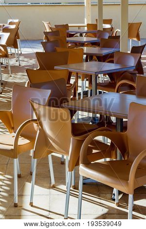 Restaurant empty tables and chairs in Greece, Corfu