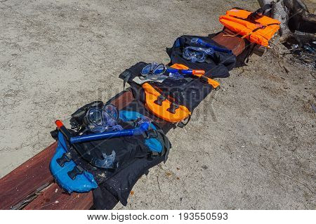 Labuan,Malaysia-May 1,2017:Various of life vests or life jackets is hung for drying out in Rusukan Besar island,Labuan,Malaysia.It is filled with buoyant material and used as a life preserver.