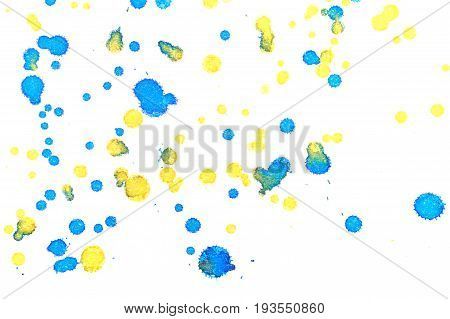 Abstract two-color yellow blue ink splash. Ink blots. Elements of design. The water-soluble ink on white paper Leste. Abstractionism