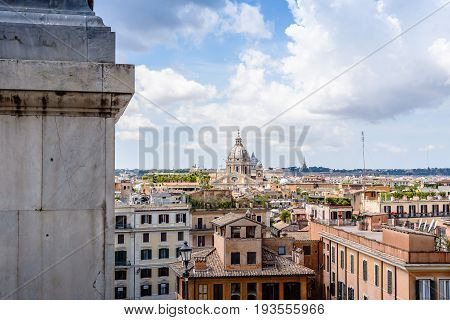 Rome Italy - August 18 2016: View of Rome from Piazza della Trinita dei Monti a sunny summer day. Vatican dome on background
