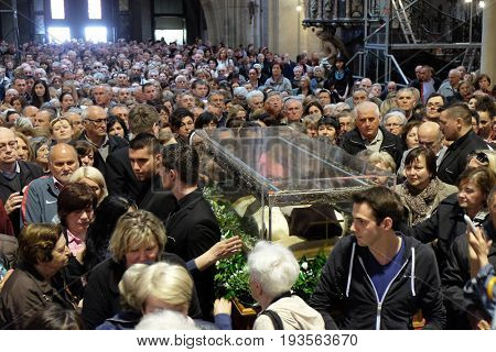 ZAGREB, CROATIA - APRIL 14: Worshippers gather to look at the relics of St. Leopold Mandic in Zagreb cathedral, Zagreb, Croatia on April 14, 2016.