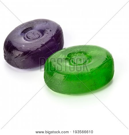 Two colorful fruit hard sugar candies,  boiled sweeties or sugar plums isolated on white background cutout