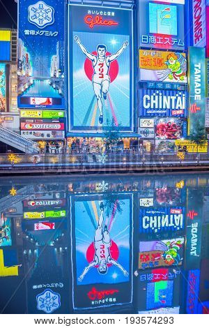 OsakaJapan - November 28 2015 : Reflection with light displays of Dontonbori in Namba OsakaJapan. Namba is well known as an entertainment area in Osaka.