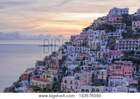 Colorful houses on the slopes of Positano and the Gallo Lungo island on the horizon - Amalfi Coast, Campania, Italy