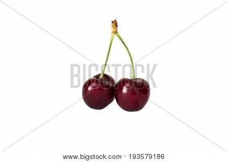 Sweet red cherries on a stem isolated on white background water drops