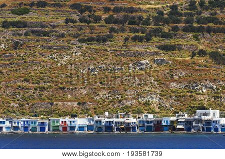 Klima village on the coast of Milos island as seen from the ferry.