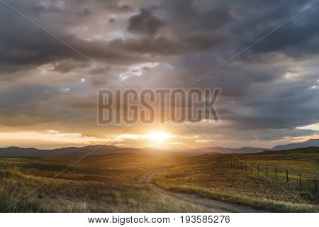Sunset in the steppe a beautiful evening sky with clouds plato Ukok no one around Altai Siberia Russia
