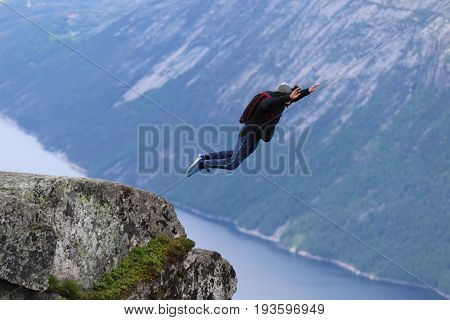 Skydiving over beautiful Norway. Clouds, sun and sky