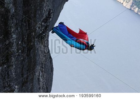 Skydiving over beautiful Norway. Clouds, sun and sky