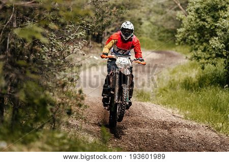 athlete bike enduro rides in forest track racing motocross