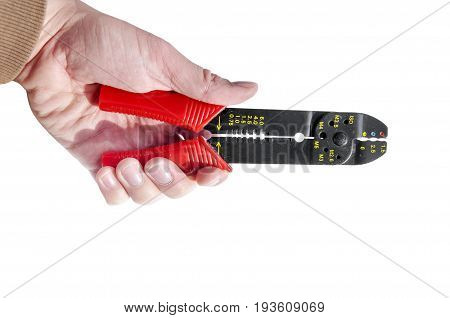 Hand holding red and black equipment plastic and metal cutter pilers for electrical cable