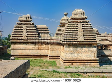 View of ancient ruins on Hemakuta hill in Hampi, Karnataka, India. Landscape with unique mountain formation with amazing stones tropical nature and temple. UNESCO World Heritage Site