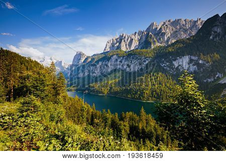 Great azure alpine lake Vorderer Gosausee. Picturesque and gorgeous morning scene. Salzkammergut is a famous resort area located in the Gosau Valley in Upper Austria. Dachstein glacier. Beauty world.