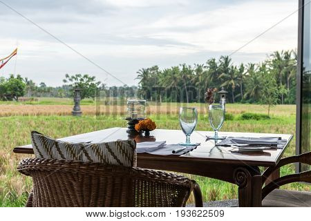 Restaurant facing the rice fields in Bali. Traditional Balinese restaurant facing the rice fields.