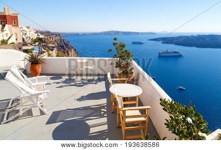 Breathtaking view of the caldera from a balcony in Imerovigli, Santorini, Greece.