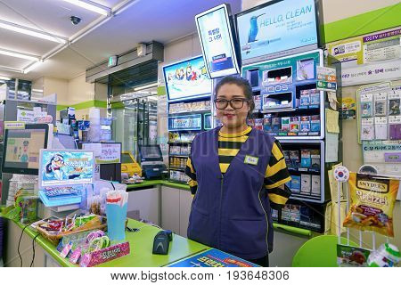 SEOUL, SOUTH KOREA - CIRCA JUNE, 2017: worker at CU convenience store. CU is a convenience store franchise chain in South Korea.