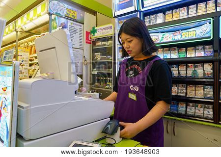 SEOUL, SOUTH KOREA - CIRCA MAY, 2017: worker at CU convenience store. CU is a convenience store franchise chain in South Korea.