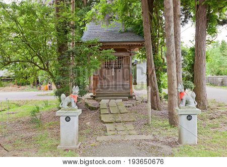 DAISEN JAPAN - MAY 26 2017: Small worship hall of Inari Shinto Shrine with kitsune fox guards. Located on the grounds of Naganobeyama Daisen Buddhist Temple in Daisen Akita Prefecture Japan