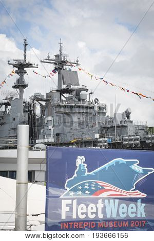 Ship Tour USS Kearsarge (LHD 3) Wasp-class amphibious assault ship: Fleet Week sign at the Intrepid Sea, Air & Space Museum on Pier 86N. Fleet Week NEW YORK MAY 25 2017.