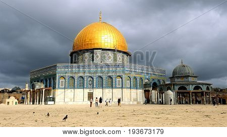 Clouds over Dome of the Rock in Jerusalem over the Temple Mount. Golden Dome is the most known mosque and landmark in Jerusalem and sacred place for all muslims.
