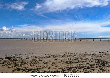 Severn suspension bridge toll motorway crossing between England and Wales. Taken on a bright blue sky early summer day.