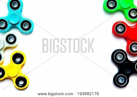 Fidget finger spinner anxiety relief toy on white isolated background copyspace. Concept relieving stress