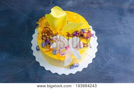 yellow cream cheese cake with chocolate twist and isomalt decoration